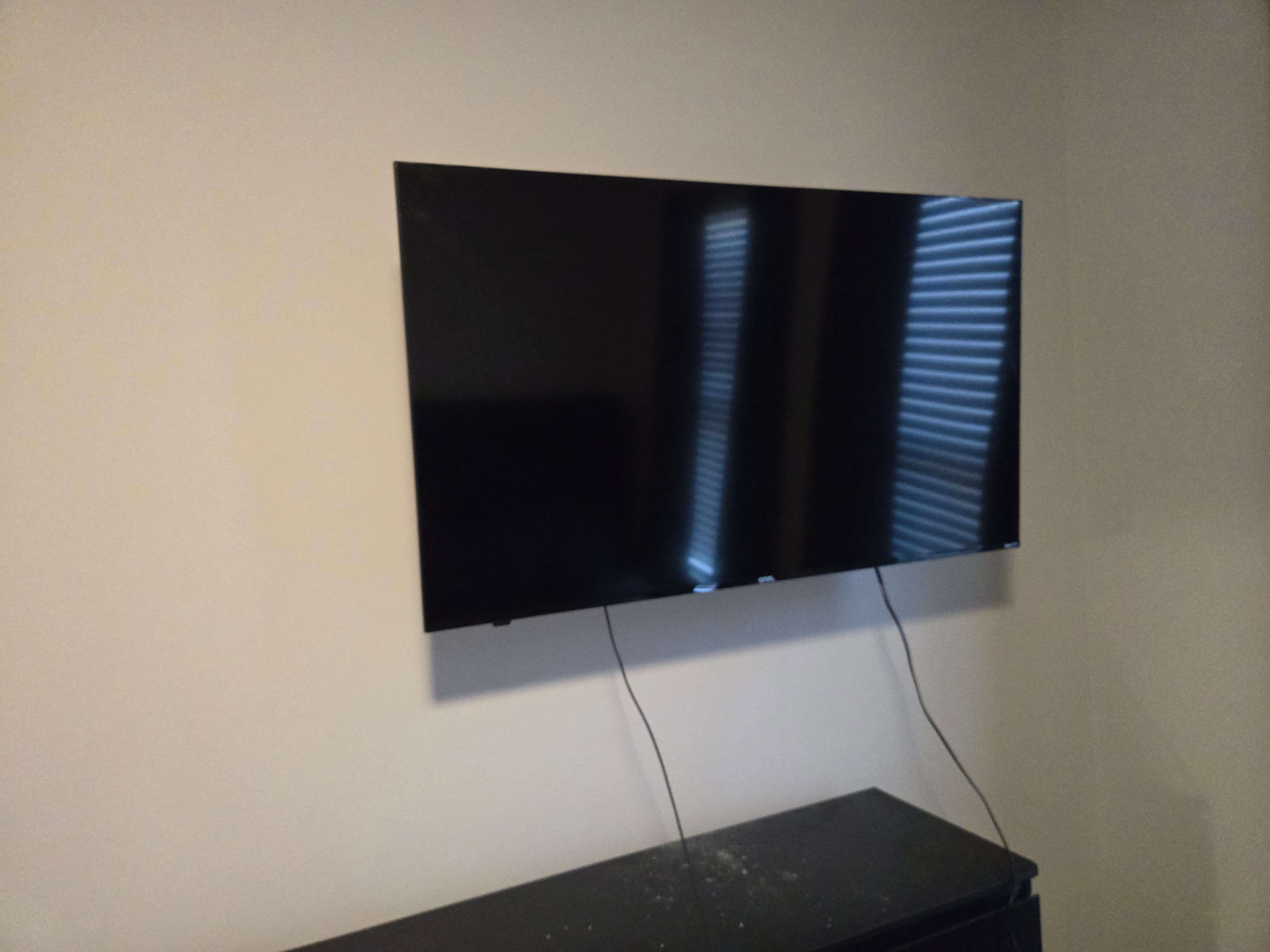 Existing TV wall mount on a wall, for removal service by Mount & Fix Dallas