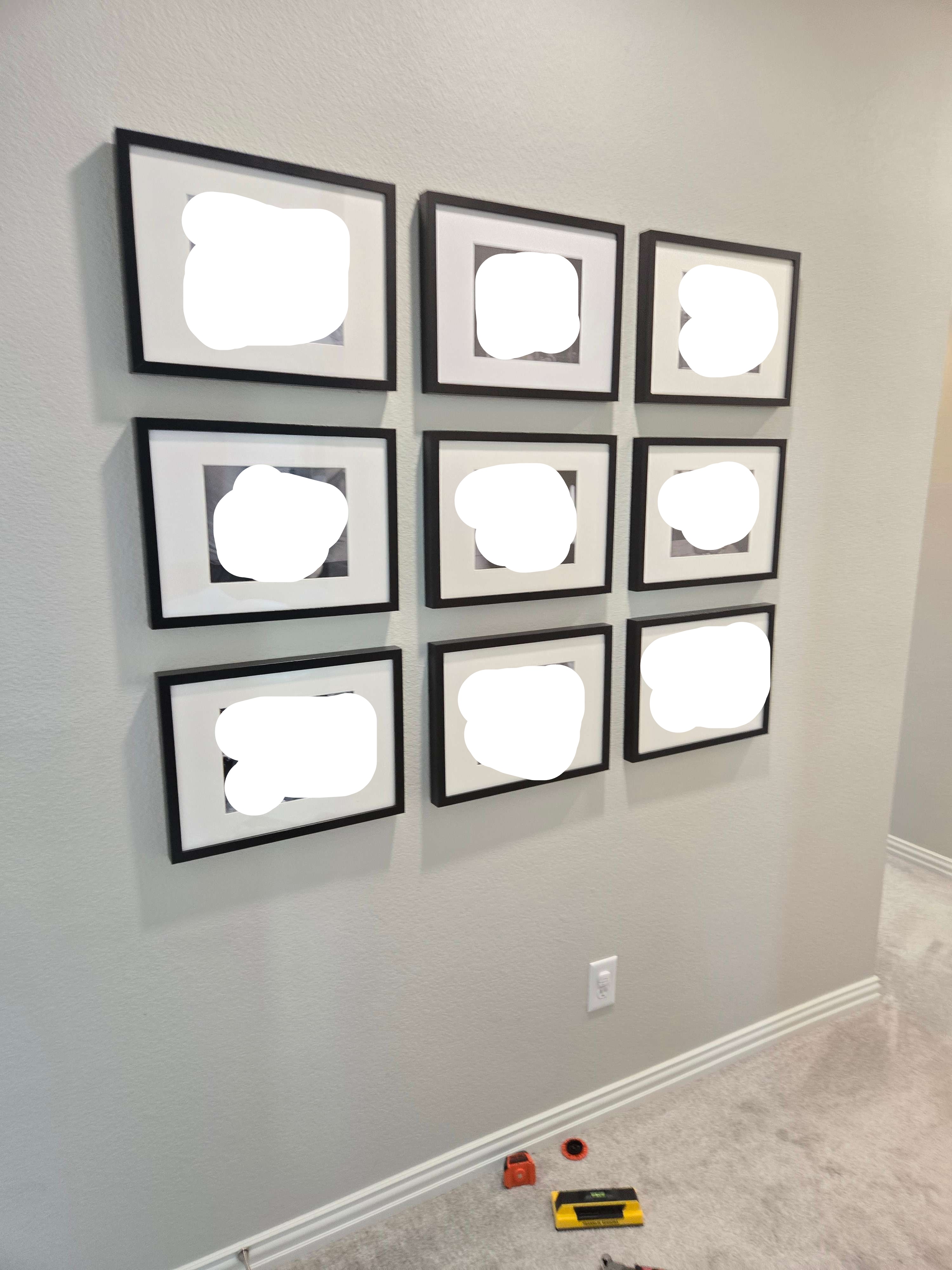Another view of a framed gallery wall, art installation by Mount & Fix DFW